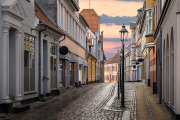 A beautiful colorful street at sunset in Viborg, Denmark. Beautiful city street in Denmark. Denmark...