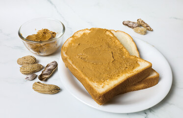 peanut butter on bread with nuts