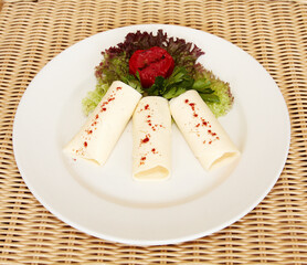 these are cold appetizers on a white platter
