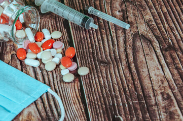 A Lot Of Different Drugs, Pills And Other Medicine On The Wooden Table