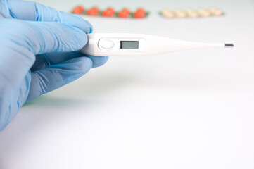 Tablets And A Protective Blue Mask Lie On A White Background