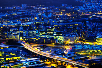 Fototapeta premium Aerial view of Bergen, Norway at night. Illuminated roads and car traffic