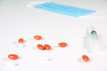 Tablets And A Protective Blue Mask Lie On A White Background