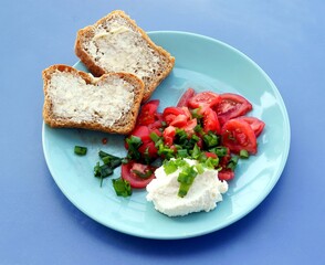 tomato salad,onions,cheese and bread as tasty breakfast