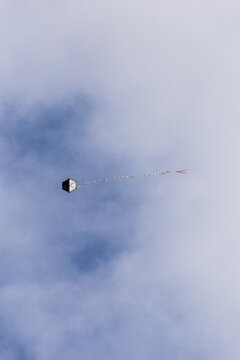 kite flying in the sky with clouds