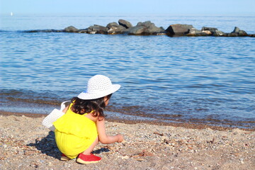 child playing in the beach.kid having fun outdoors .summer vacation and healthy lifestyle