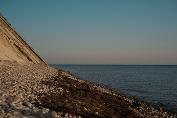 A rocky beach next to a body of water