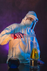 Nurse wearing hazmat suit, protective goggles and antiviral mask kn95 for covid19, dark room...