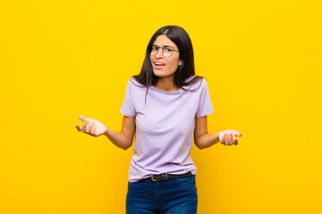 young pretty latin woman feeling clueless and confused, not sure which choice or option to pick,...