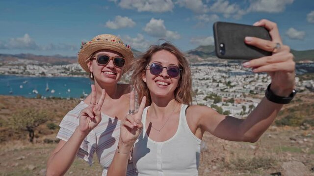 Travel concept, happy girls make picture together and having fun on camera in Bodrum Turkey