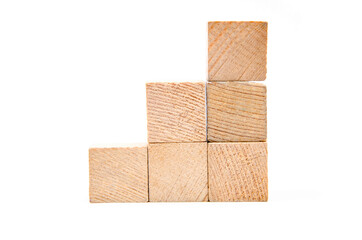 Wooden cubes on a white background. Cubes in the form of stairs, career climb