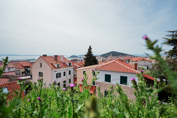 Fototapeta na wymiar Beautiful cityscape with red tiled roofs of Split old town, Croatia.