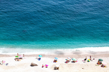 summer vacation holidays, aerial view of people sunbathing on the beach