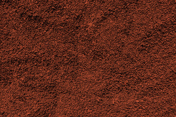 Reddish bronze colored sand paper. Textured background with sparkles and glitters