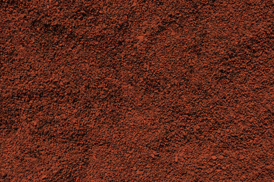 Reddish bronze colored sand paper. Textured background with sparkles and glitters