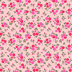 Obraz na płótnie Canvas Vintage floral background. Seamless vector pattern for design and fashion prints. Flowers pattern with small pink and red flowers on a pale pink background. Ditsy style.