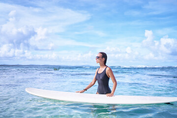 Extreme Water Sport. Surfing. Healthy Athletic Young Surfer Girl With Sexy Fit Body Holding Surf Board While Standing In Clear Water, Summer Vacation. Lifestyle. Leisure, Hobby, Wellness, Fitness.