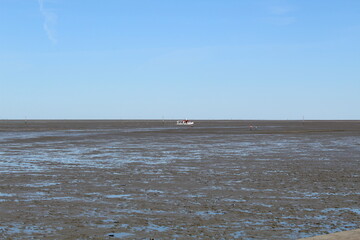 Fototapeta na wymiar The Wadden Sea at low tide in Dornumersiel, Germany