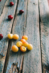 Fresh homemade ripe cherries on a wooden old background. Summer still life