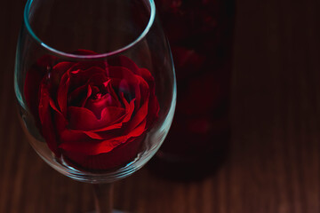Red rose in a wine glass