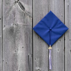 Overhead closeup shot of a blue academic cap - graduation concept
