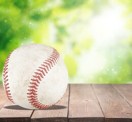 Baseball ball with seams on the wooden desk