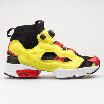 VIENNA, AUSTRIA - AUGUST 14, 2017: Reebok Instapump Fury OG Ultk yellow, black and red sneaker on white background.
