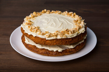 Whole carrot cake on the wooden table