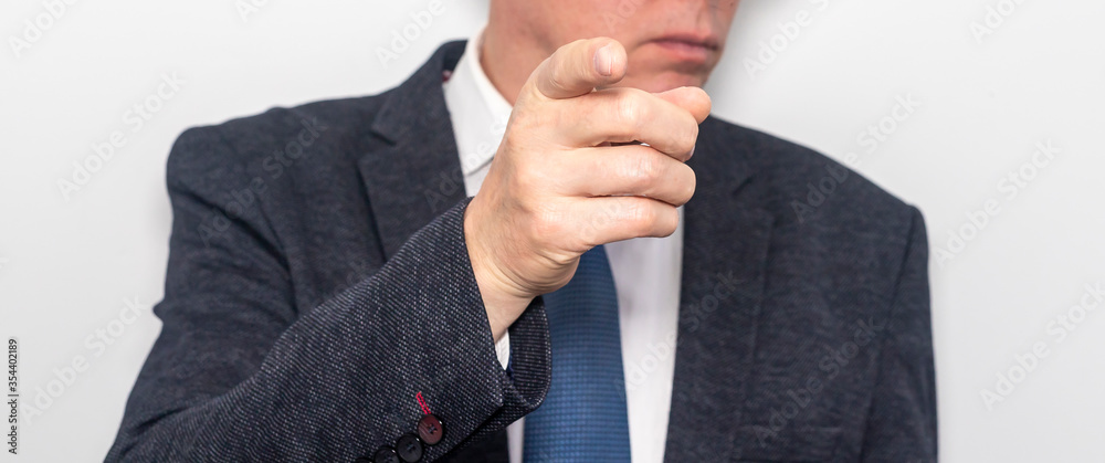 Aufkleber businessman in suit and tie pointing the finger in front of himself at the camera on white backgroun