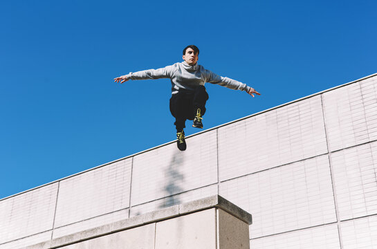 Young male guy in sports wear outdoors