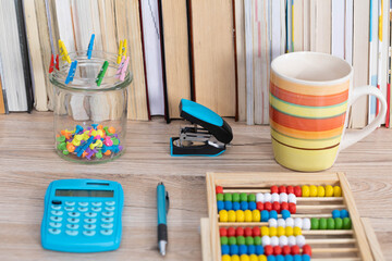 Office accessories necessary for learning. The paper clips are on the desk. School materials.