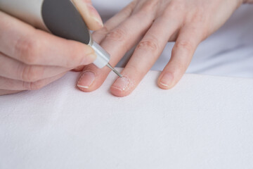 Home manicure. The care and treatment of the nails using a special apparatus. Self-care for nails,...