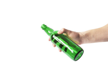 Glass bottle in hand on a white background. Empty bottle. Green bottle on a clean background