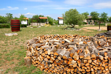 Stack of logs in the countryside. Selective focus.