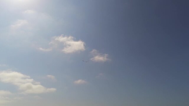 kite flying in the blue sky with clouds