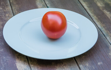 tomato on white plate