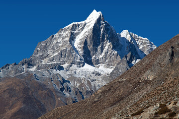 Taboche peak and Cholatse - beautiful Himalayan mountains around the way to Everest base camp, Everest area, Khumbu valley, Sagarmatha National Park, Nepal Himalayas