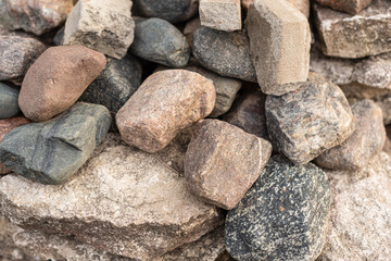 Large colored stones lie in a heap.
