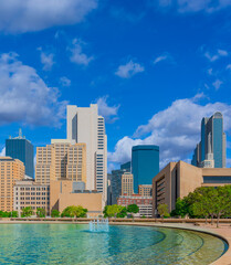 Downtown Dallas surrounds a refreshing fountain courtyard rest area.