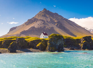 Beautiful summer day near Arnarstapi or Stapi is a small fishing village at the foot of Mt. Stapafell.  West Iceland, Europe. Beauty world.
