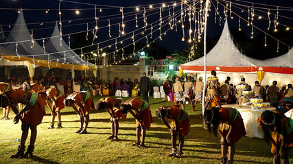 Kampala, Uganda - July 09, 2017: local performers in Uganda sing, dance and play traditional music at the wedding event, marriage ceremony in Kampala, culture and traditions in Uganda, local clothes