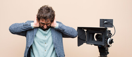 television presenter feeling stressed, worried, anxious or scared, with hands on head, panicking at...