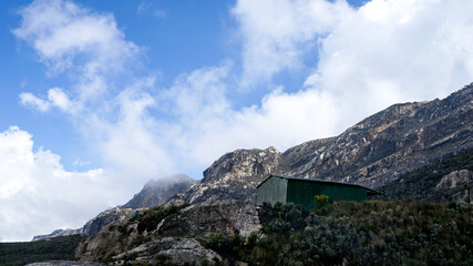 Eco-friendly green cabin on top of the peak in the mountains, Beautiful landscape in Rwenzori Mountains at Uganda, Eastern Central Africa,  Bugata Camp on the clear sunny day in summer, Little green h
