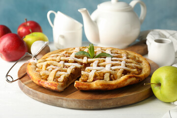 Tasty apple pie on white wooden background, close up. Homemade food