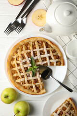 Composition with apple pie on white wooden background. Tasty lunch. Homemade breakfast
