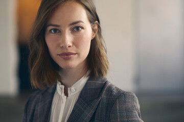 Close up portrait of the most beautiful and professional female CEO business woman wearing a suit,...