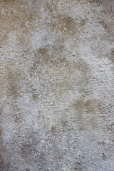 Vertical closeup of a texture of gray raw concrete