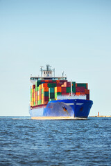 Large cargo container ship sailing from Europoort (Rotterdam, Netherlands) in an open sea on a...
