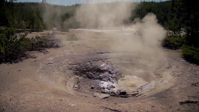 Geyser erupting in Norris Geyser Basin, Yellowstone National Park, Wide Shot