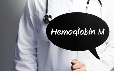 Hemoglobin M. Doctor with stethoscope holds speech bubble in hand. Text is on the sign. Healthcare, medicine